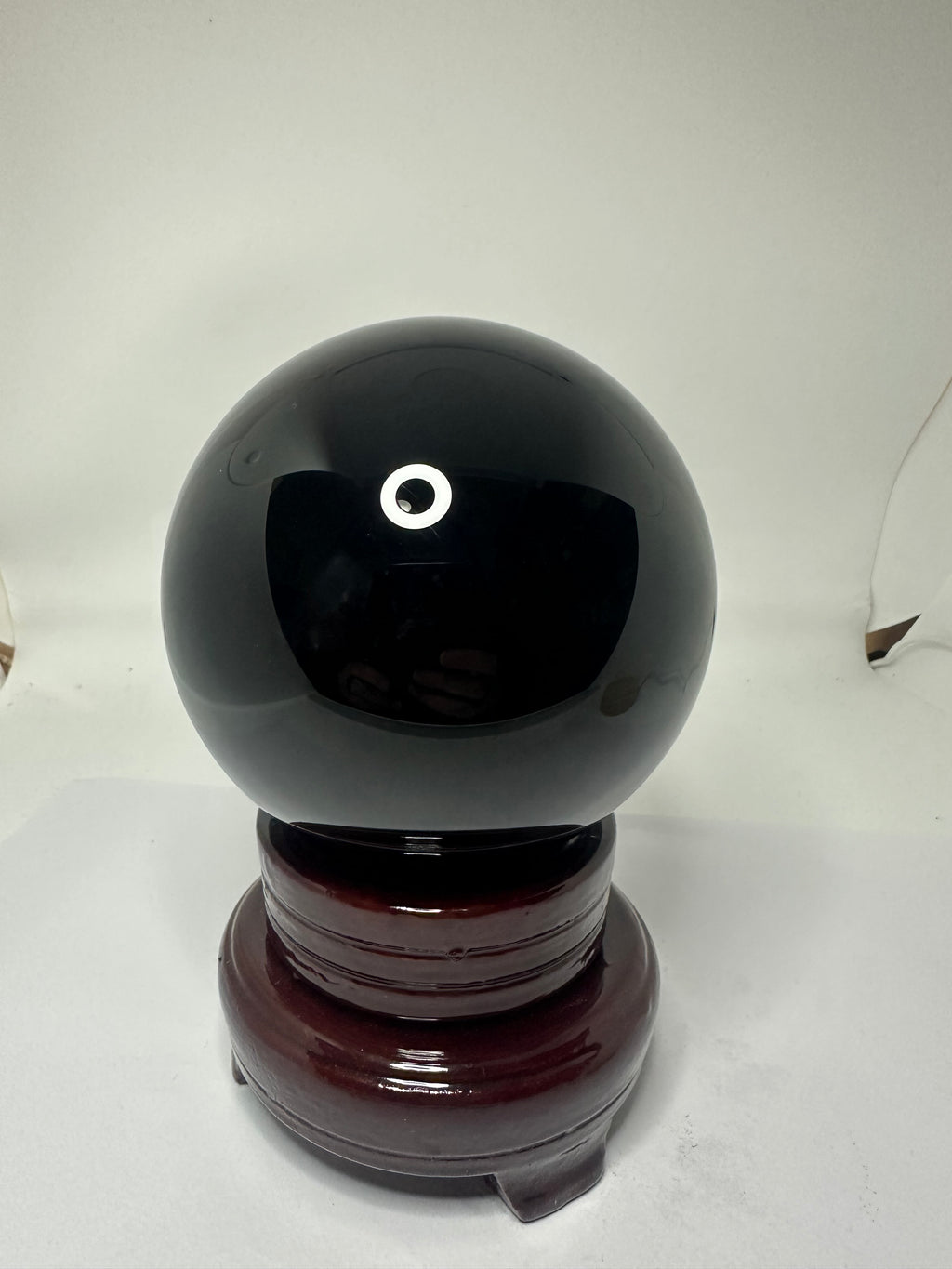 Polished black obsidian sphere, 95mm and 1.24kg, shown from another angle
