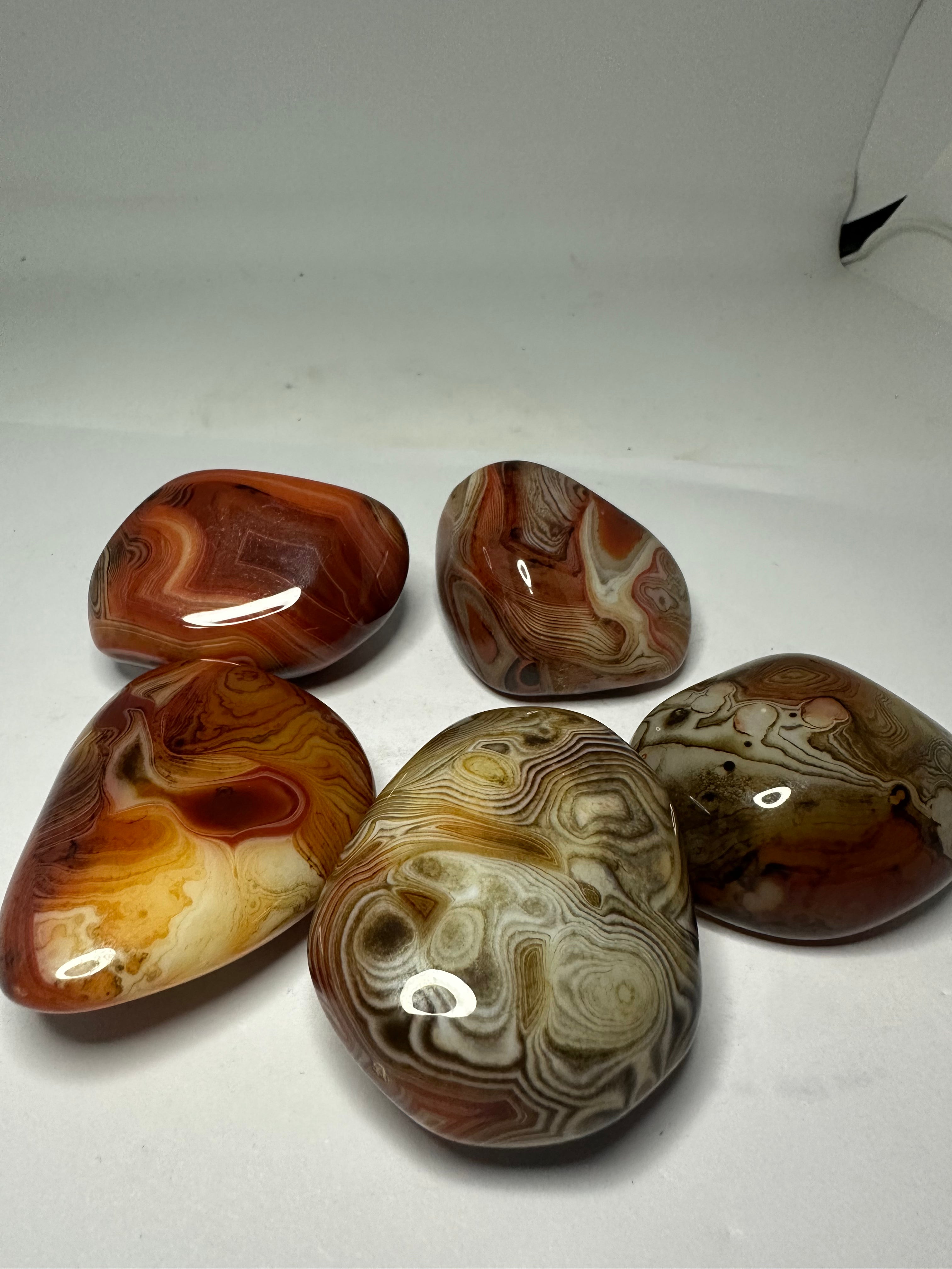 Polished sardonyx palm stone, 85-95g