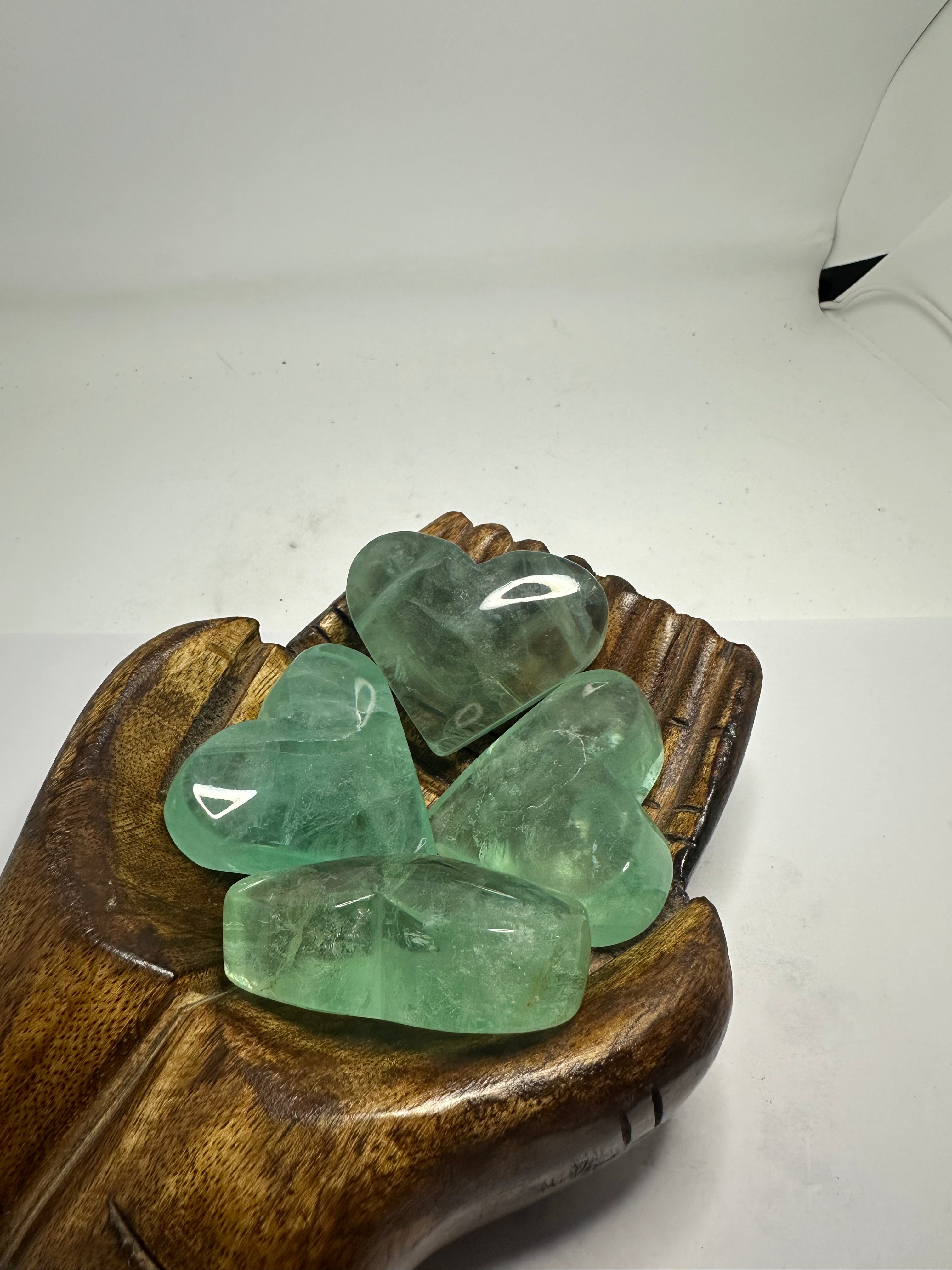 Polished green fluorite heart, 80-90g, shown from another angle